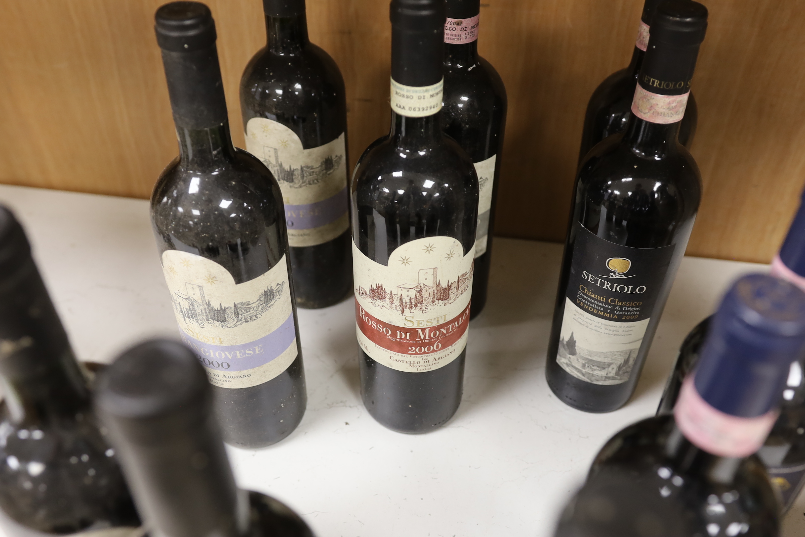 Eleven bottles of various wines to include four bottles of Grangiovese 2000, Rossi di Montalcino1998, 2000, 2006 and four other wines